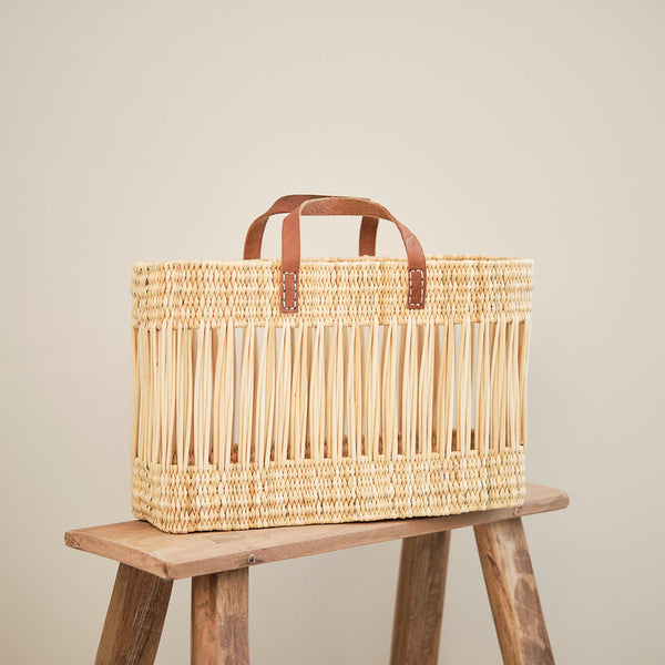 Why the Kiota Loves Reed Baskets and Checkered Rug Are Essential for Every Home